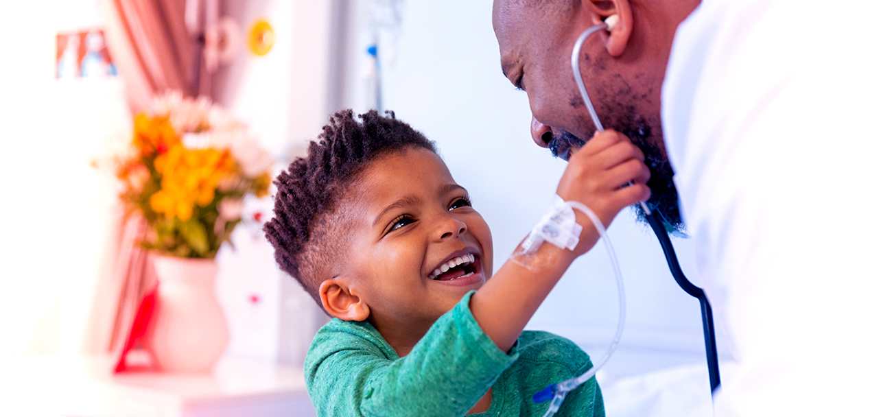 Laughing,African,American,Boy,Patient,Taking,Male,Doctor's,Stethoscope,In